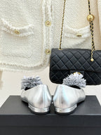 Chanel ladies silver ballet flats with white flower details and rounded toe