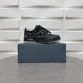 Luxury low-top sneakers in black with AMIRI branding and patterned side logo