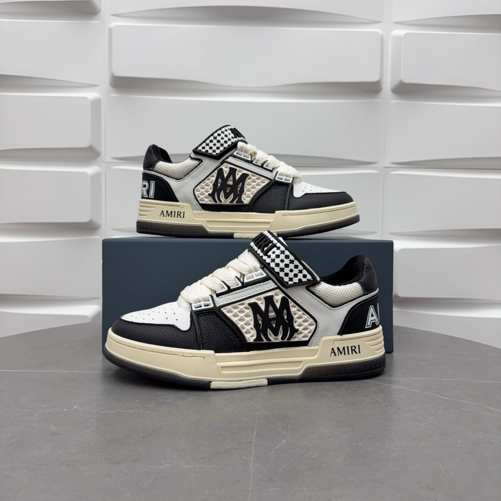 Black and white low-top sneakers with checkered strap, lace-up, beige sole.