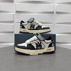 Black and white low-top sneakers with checkered strap, lace-up, beige sole.