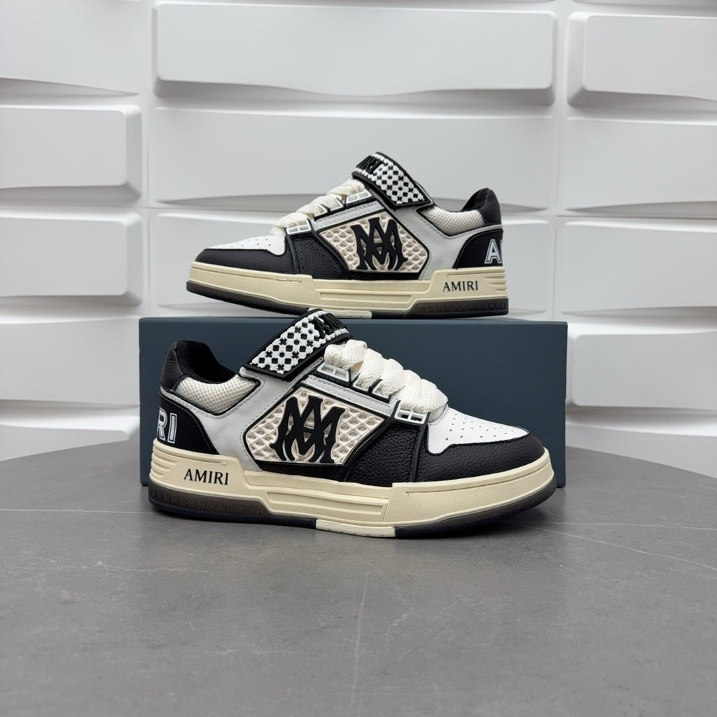 Pair of black and white sneakers, checkered strap and lace-up, beige sole.