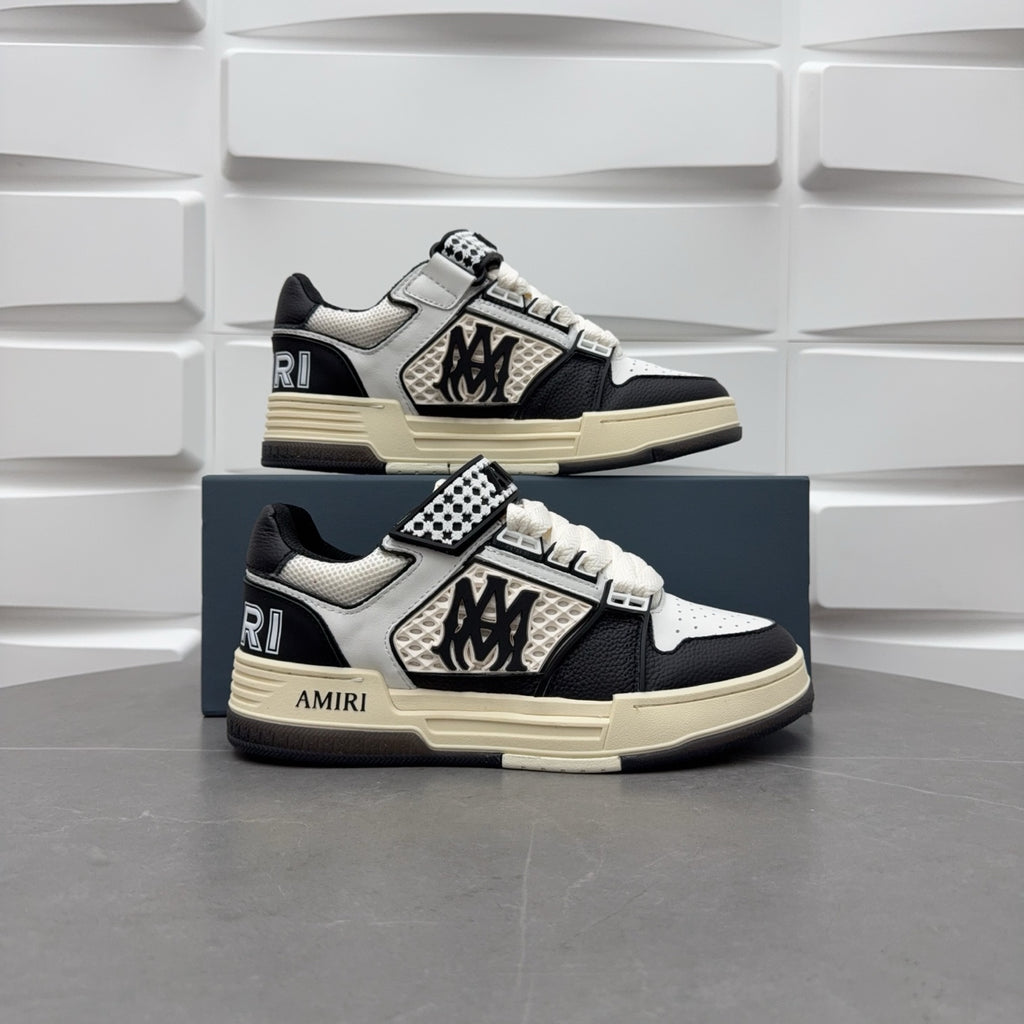 Pair of black and white low-top sneakers, checker strap, lace-up, beige sole.