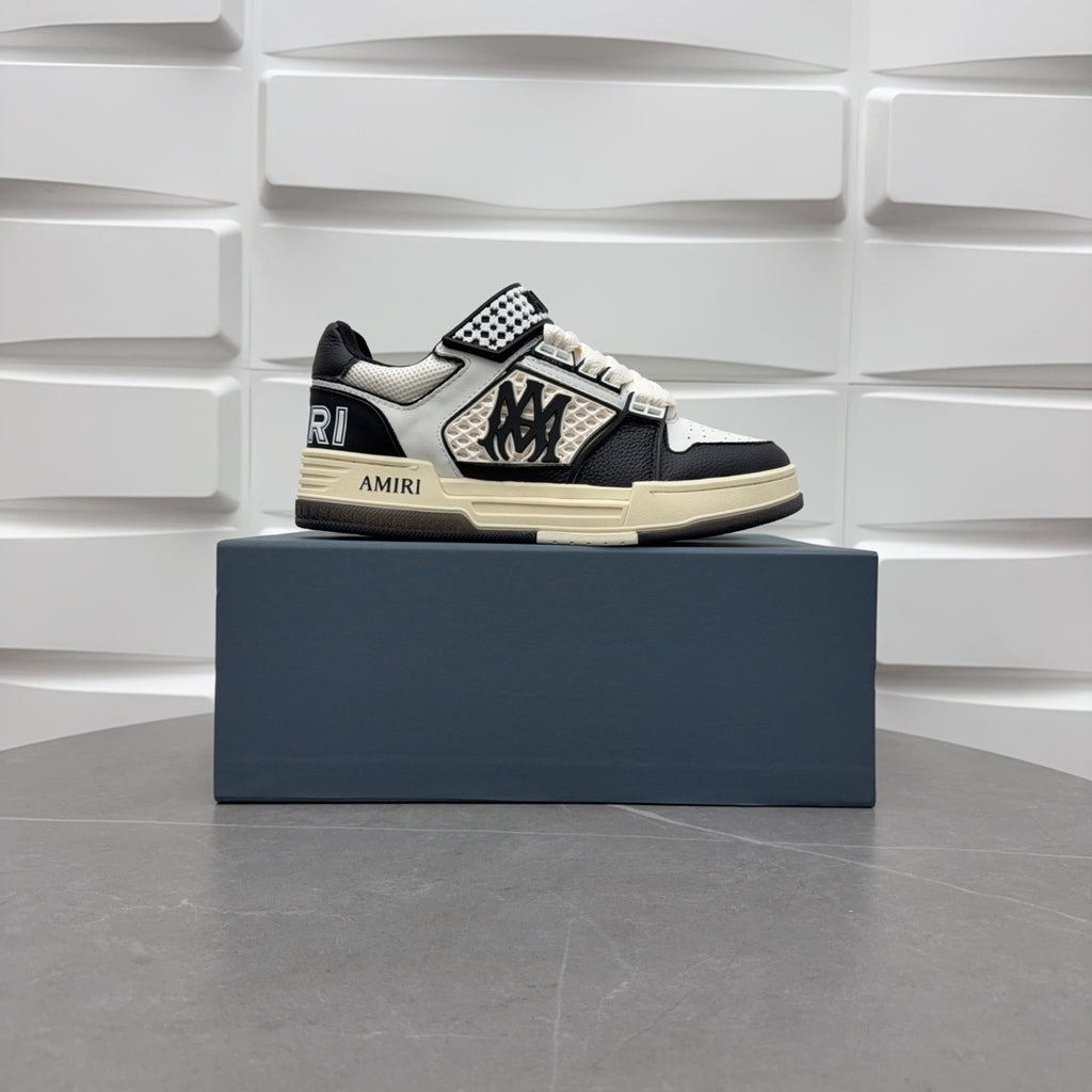 Black and white low-top sneakers with checker strap, lace-up, beige sole.