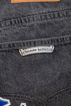 Chrome pants pocket label detail with logo tag and orange trim