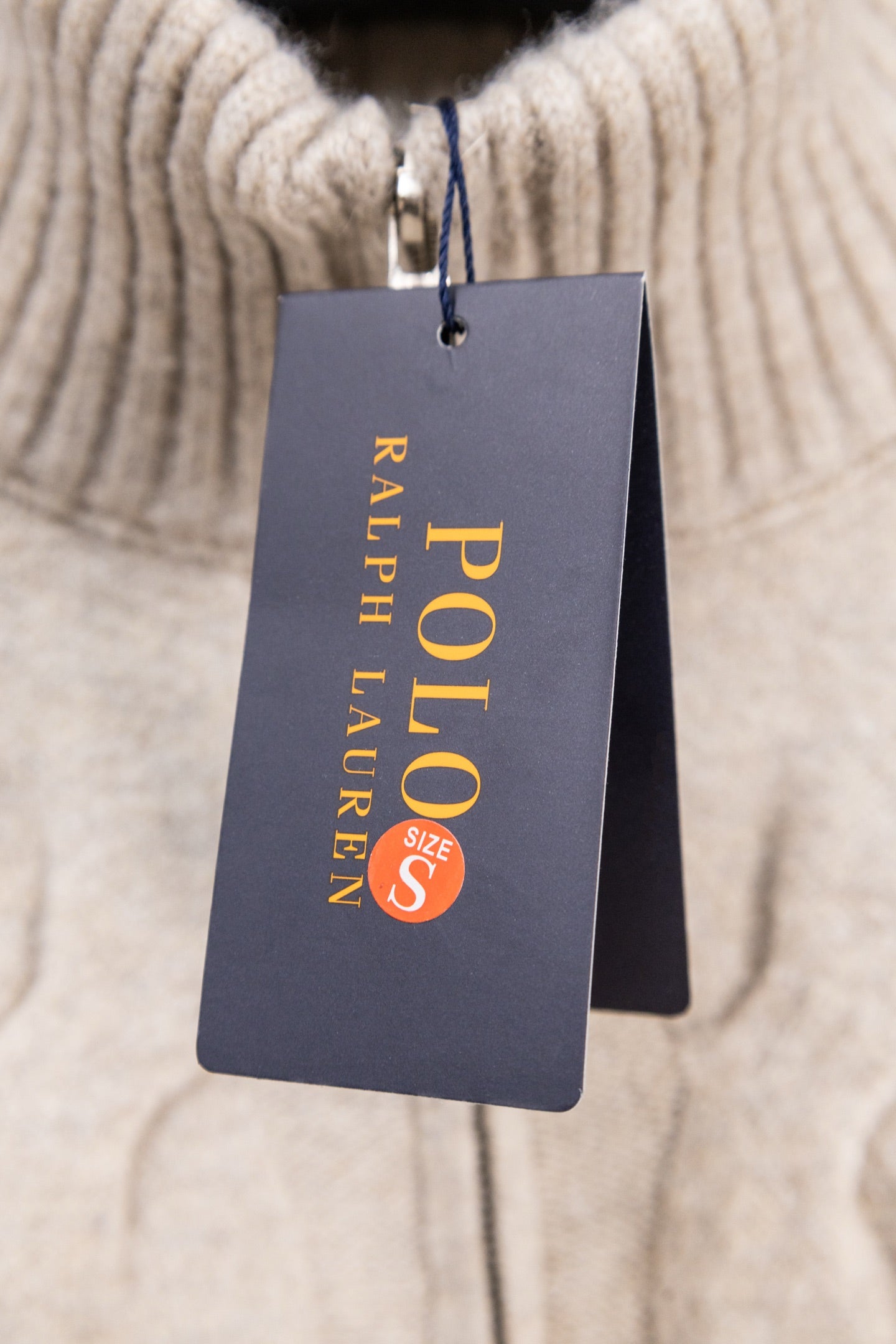 Beige ribbed knit sweater with Polo Ralph Lauren hang tag