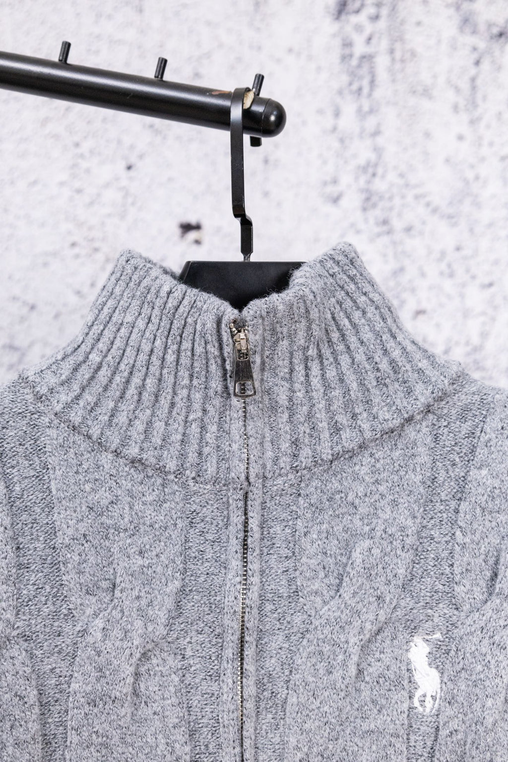 Heather gray knit sweater back with half-zip opening and ribbed collar