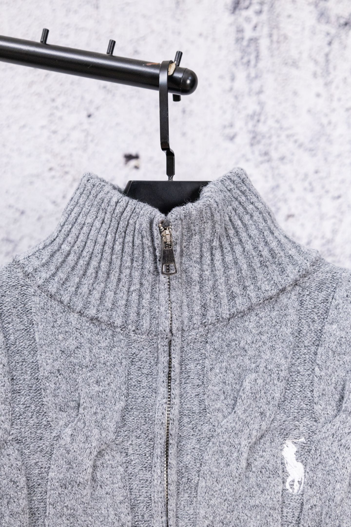 Heather gray knit sweater back with half-zip opening and ribbed collar