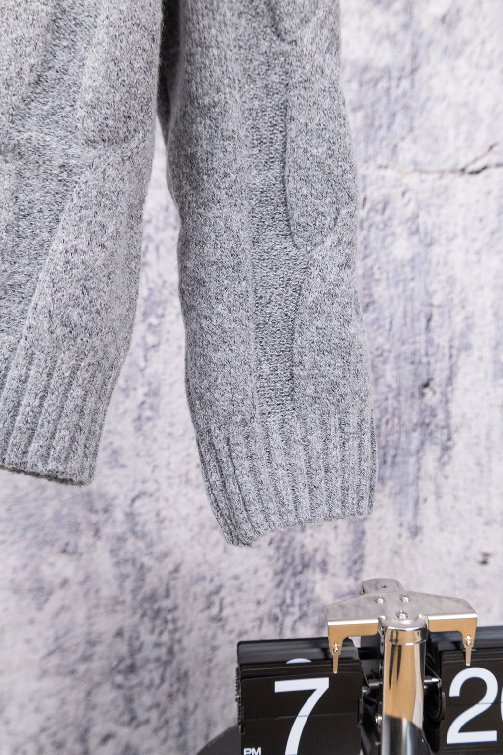 Heather gray knit sweater sleeve with ribbed cuff