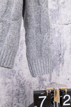 Heather gray knit sweater sleeve with ribbed cuff
