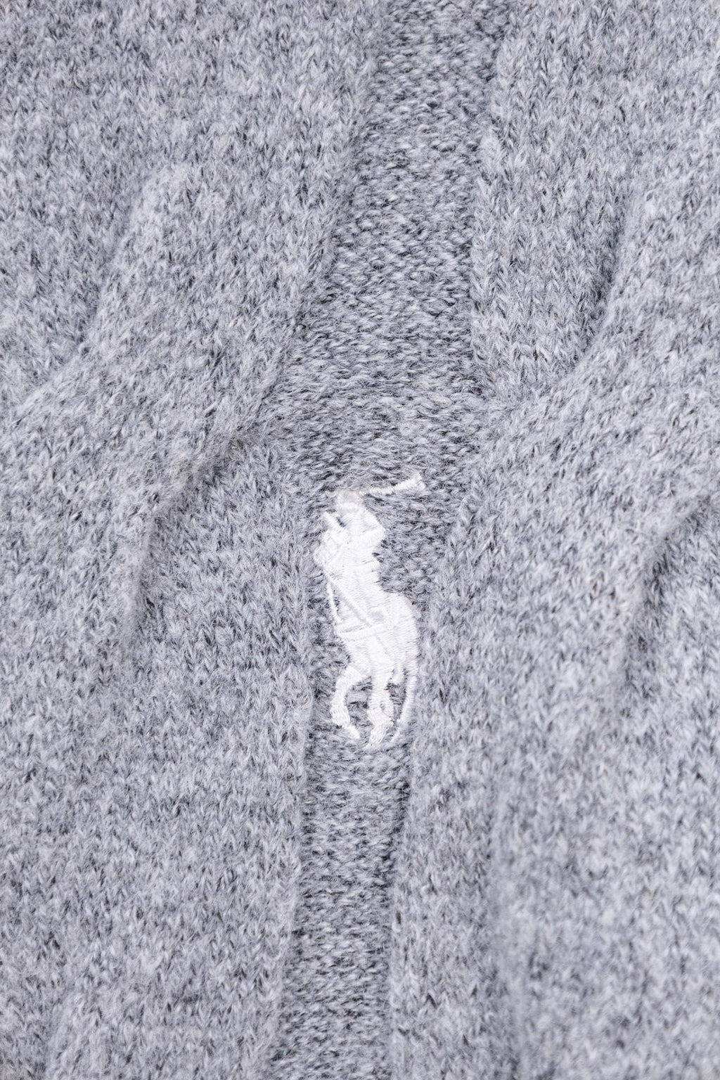 Heather gray knit sweater fabric texture with vertical seam
