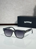 Black cat-eye sunglasses with dark lenses and crystal temple accents