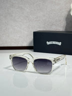 Metal cat-eye sunglasses with clear frames and dark lenses