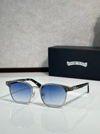 Sunglasses with blue-tinted lenses and silver frame, textured temple and logo