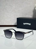 Sunglasses with black lenses, black frame, chrome arms with logo detail