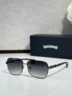 Black-tone aviator sunglasses with dark lenses and rhinestone logo on temple