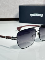 Black-tone aviator sunglasses with dark lenses and brown leather-textured temples