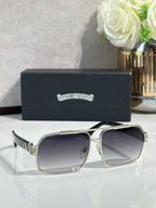 Silver square sunglasses with dark gradient lenses and crystal logo