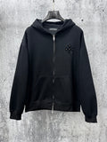 Black zip-up hoodie with rhinestone chest emblem and silver front zipper