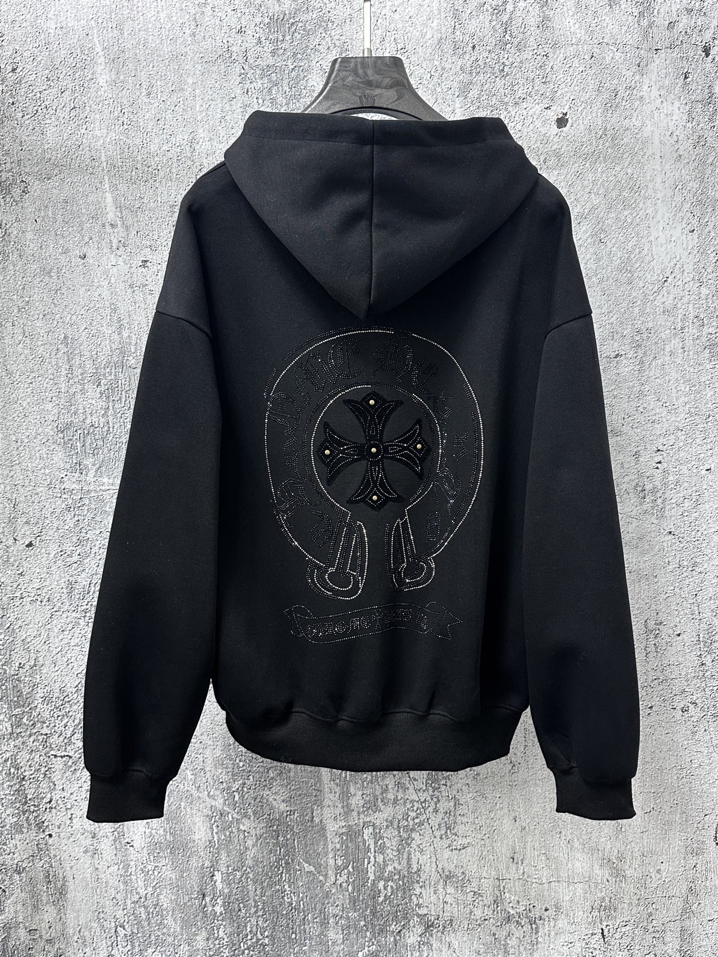 Black zip-up hoodie with large rhinestone back graphic and hood