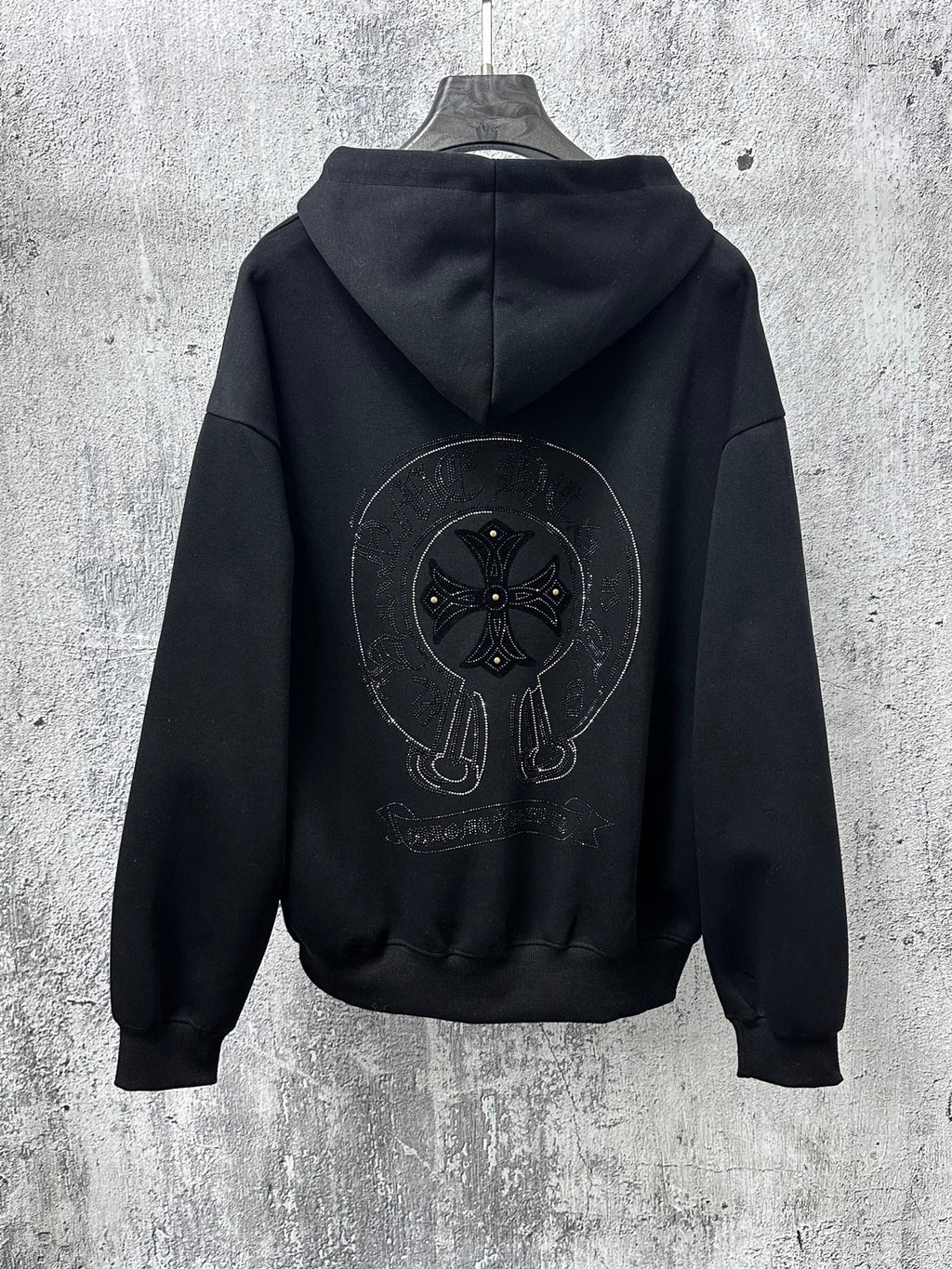 Black zip-up hoodie with hood and large back graphic, front zipper and kangaroo pockets