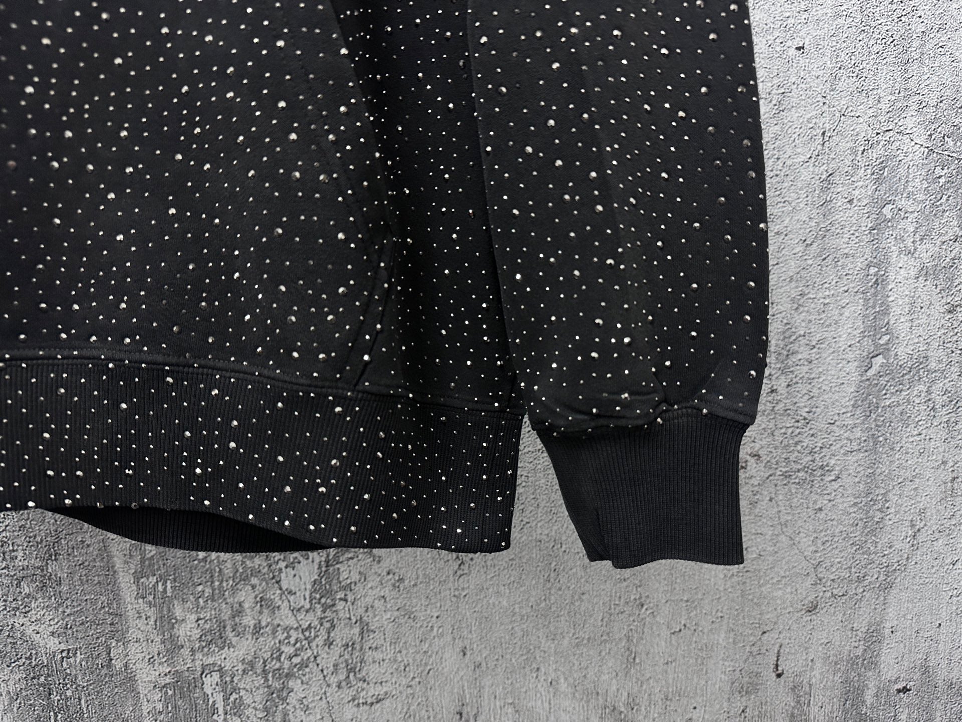 Balenciaga long-sleeve hoodie lower sleeves, dark with white speckle print