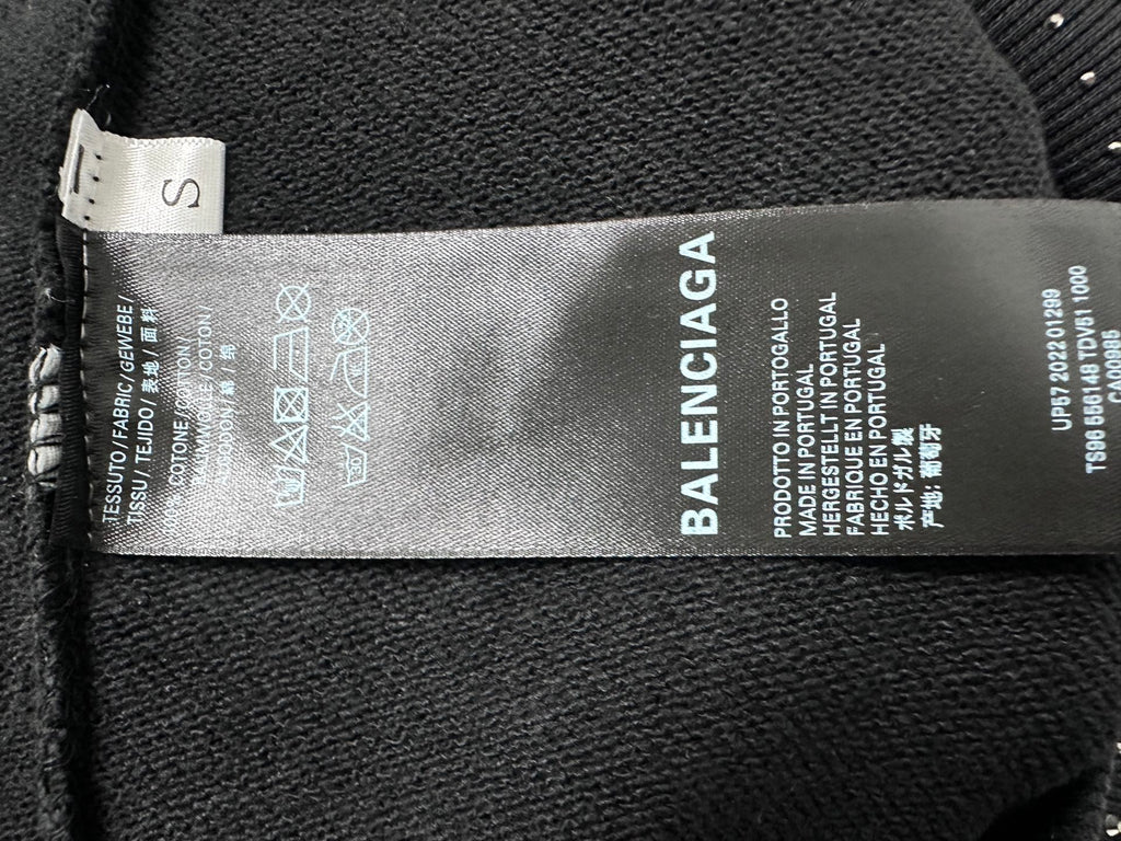 Balenciaga hoodie interior care label on dark fabric