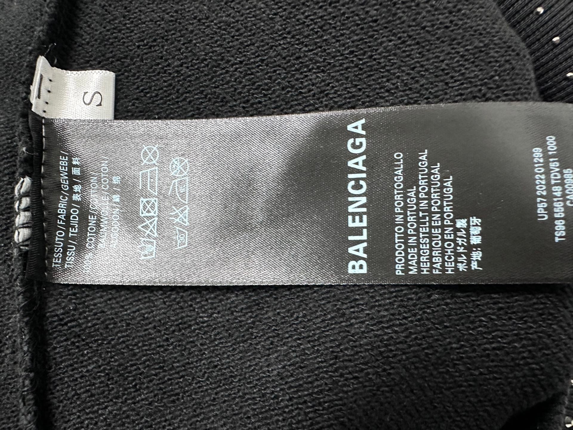 Balenciaga hoodie interior care label on dark fabric
