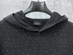 Balenciaga long-sleeve hoodie front, dark with white speckle print, ribbed hood
