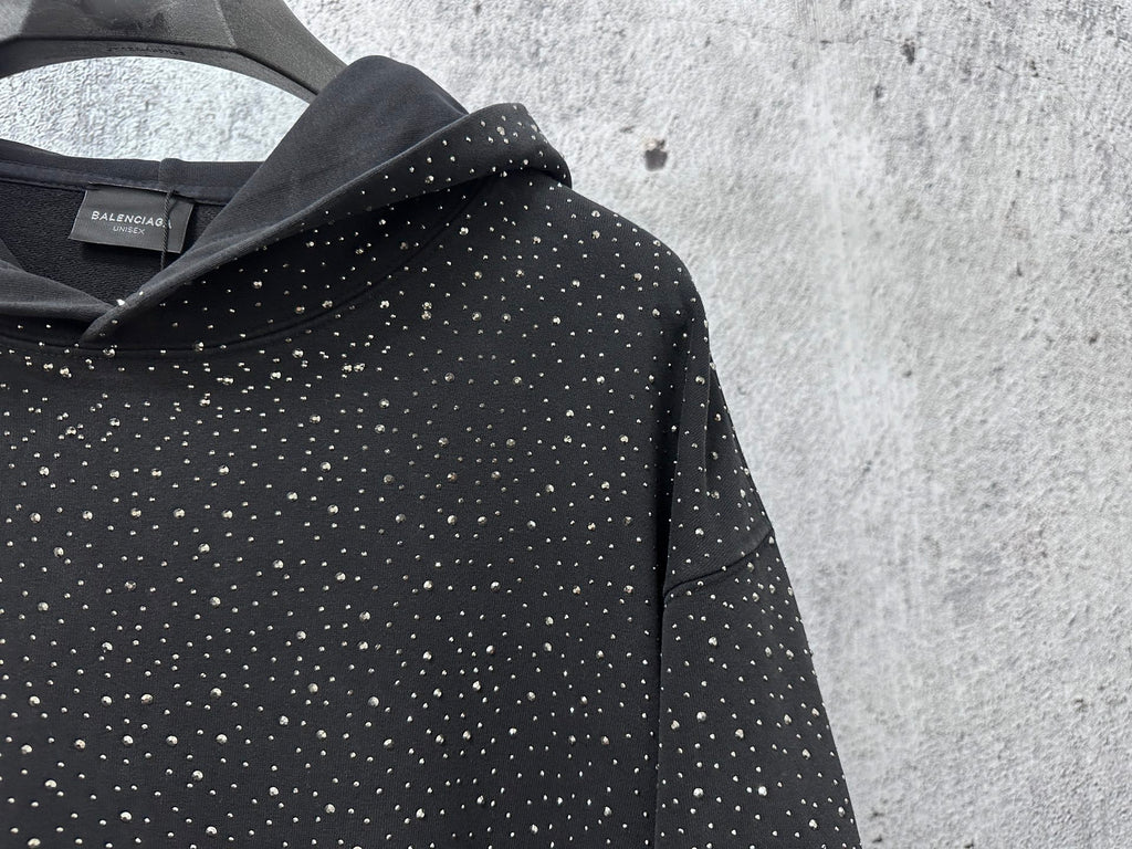 Balenciaga long-sleeve hoodie hood close-up, dark with white speckle print