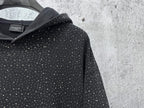 Balenciaga long-sleeve hoodie hood close-up, dark with white speckle print