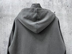 Long-sleeve hoodie back view, dark gray with cowl hood and speckled dots