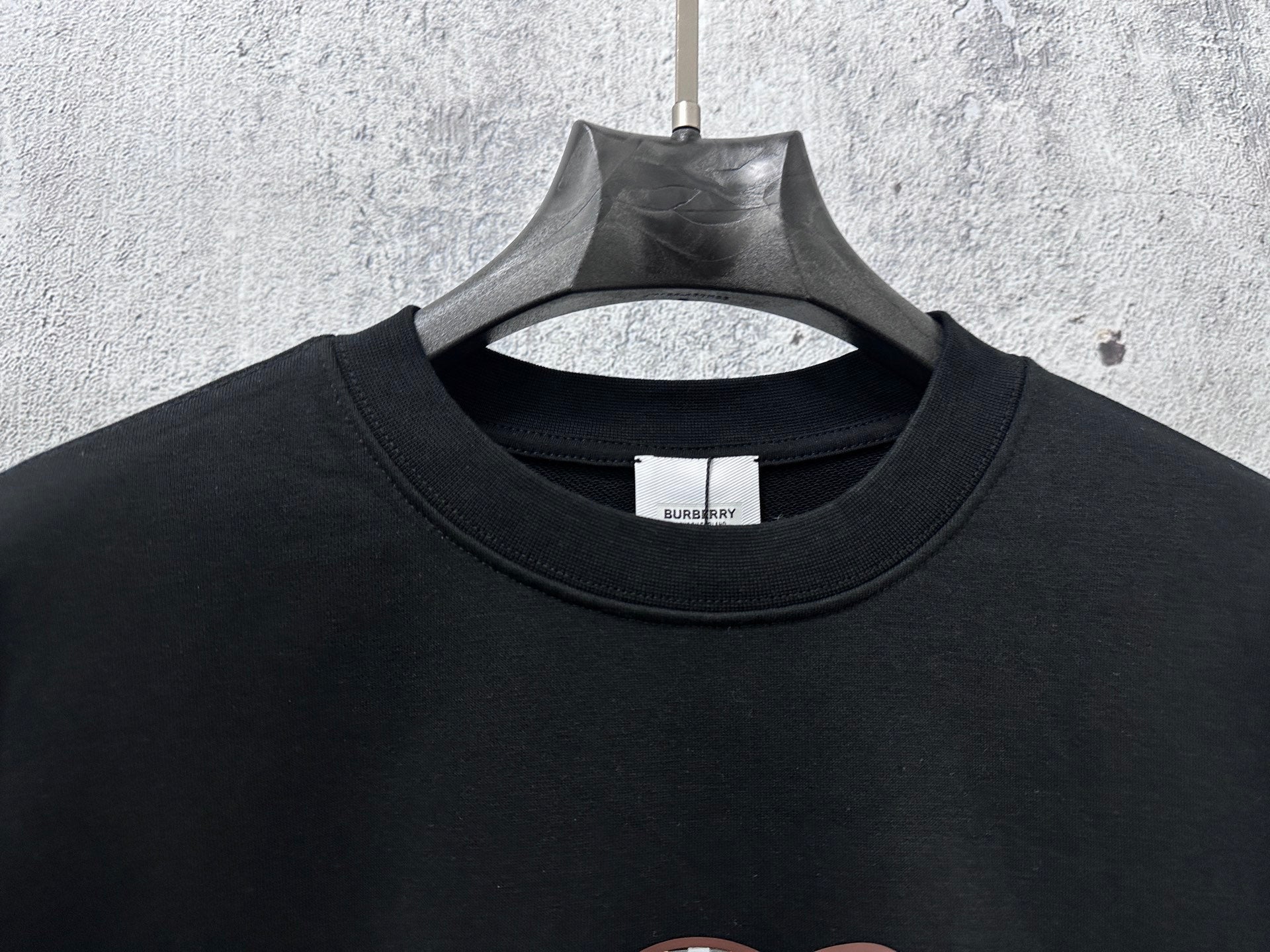 Black crewneck sweatshirt with Burberry neck label