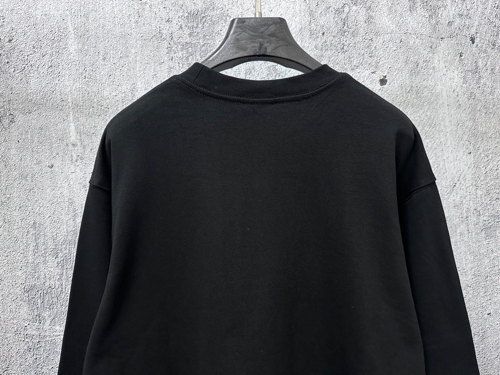 Black long-sleeve sweatshirt back view with ribbed neckline and hem