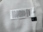 White sweatshirt fabric label reading Burberry with size M tag