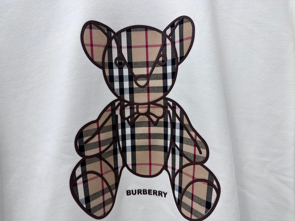 Check-pattern teddy bear graphic on white sweatshirt with Burberry text