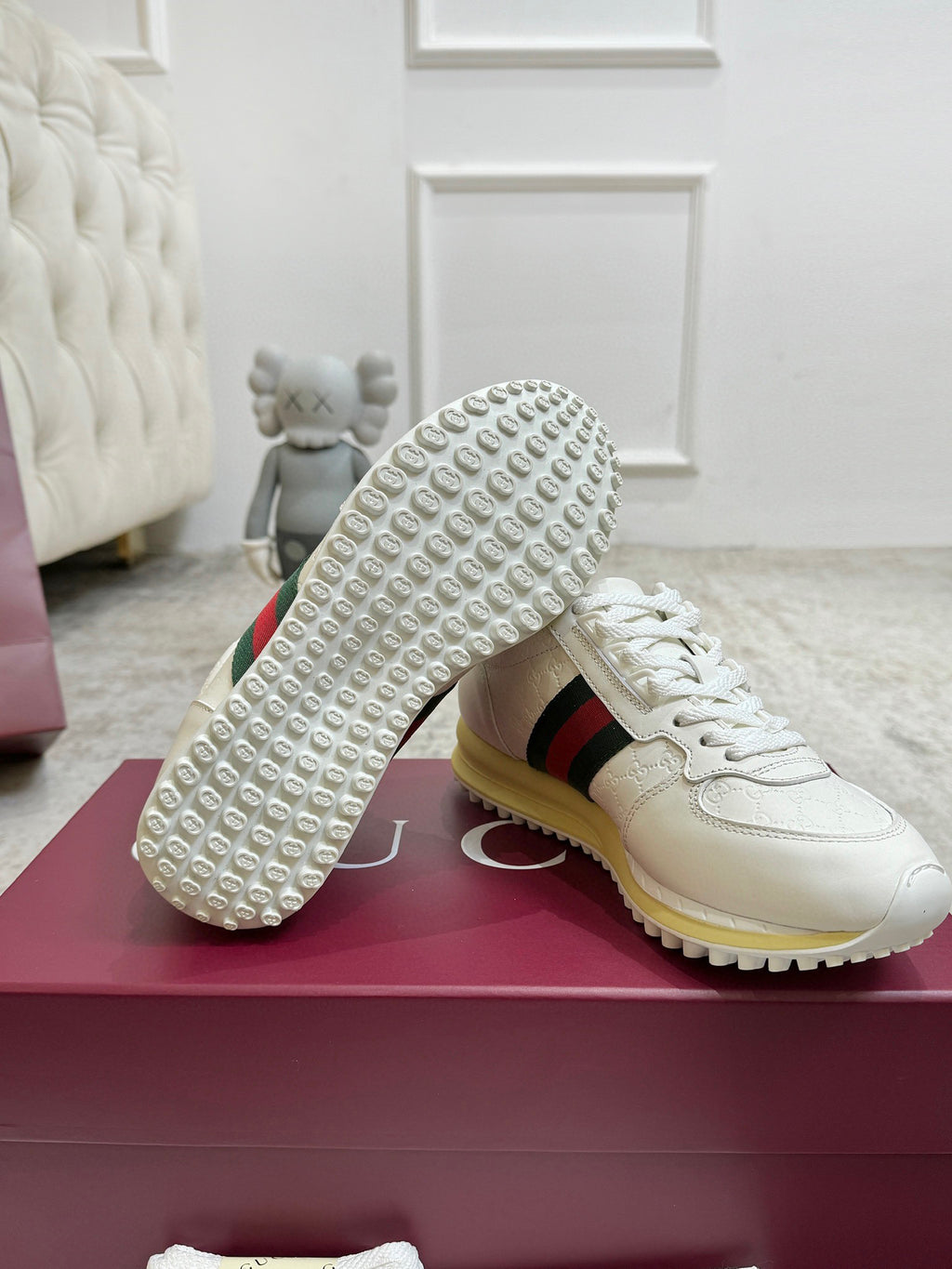 Gucci unisex sneaker outsole shown: white shoe with yellow edge and textured grip tread