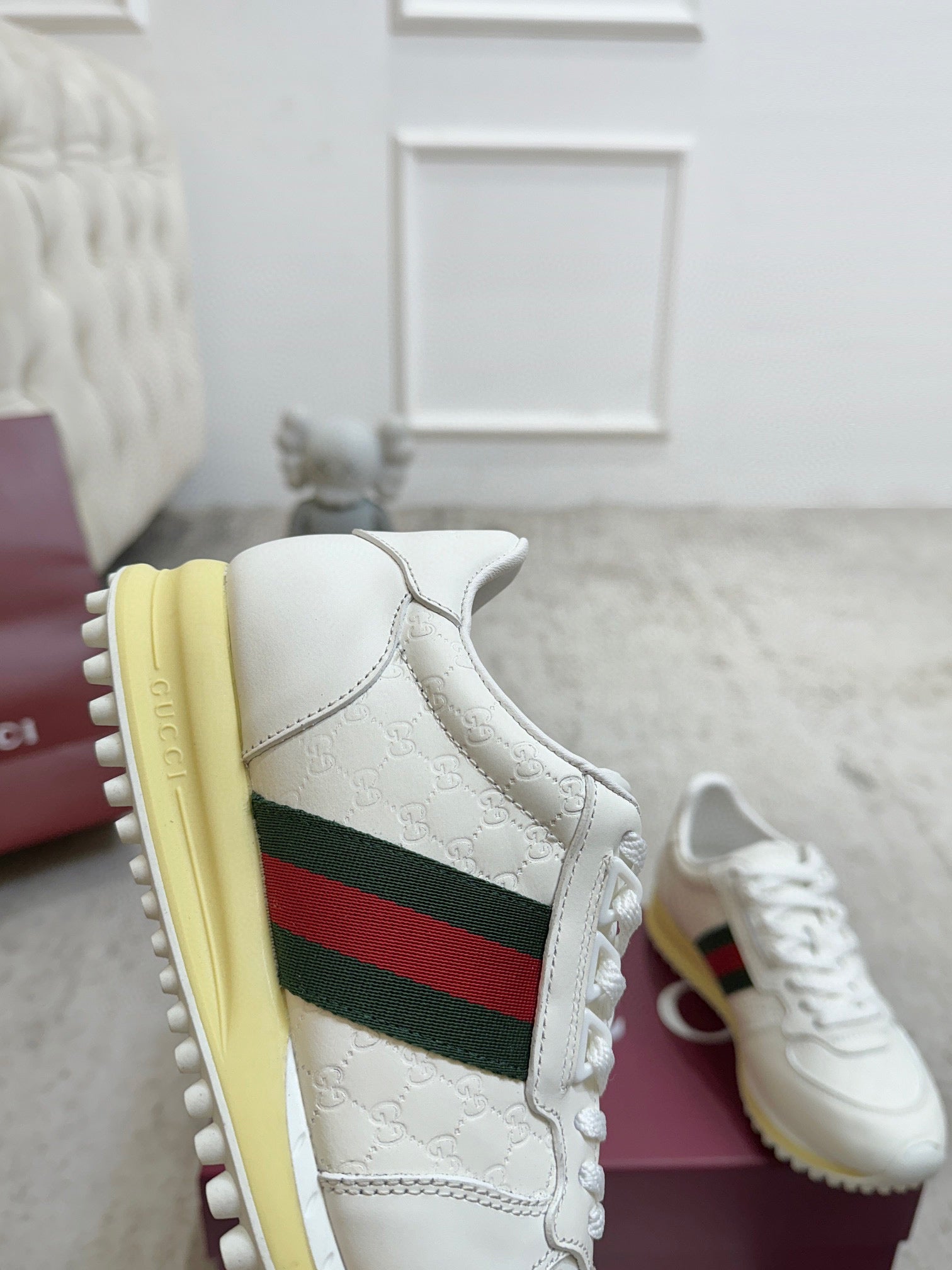 White Gucci leather sneaker with green-red web stripe and thick yellow sidewall