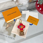 Louis Vuitton bear charm keychain with red flower cap, blue details, tan body