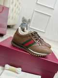 Gucci unisex sneakers in tan leather with green-red web stripe and lace-up design
