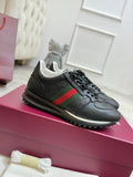Gucci unisex lace-up sneakers, black with green and red web stripe, textured logo toe