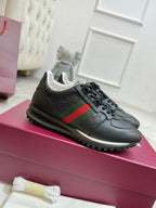 Gucci unisex lace-up sneakers, black with green and red web stripe, textured logo toe