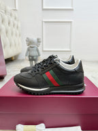 Gucci unisex lace-up sneakers, black with green and red stripe, chunky tread rubber sole