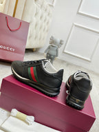 Gucci unisex sneakers, black with green and red stripe, lace-up with padded collar