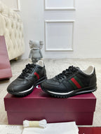 Gucci unisex lace-up sneakers, black with green and red web stripe, embossed logo details