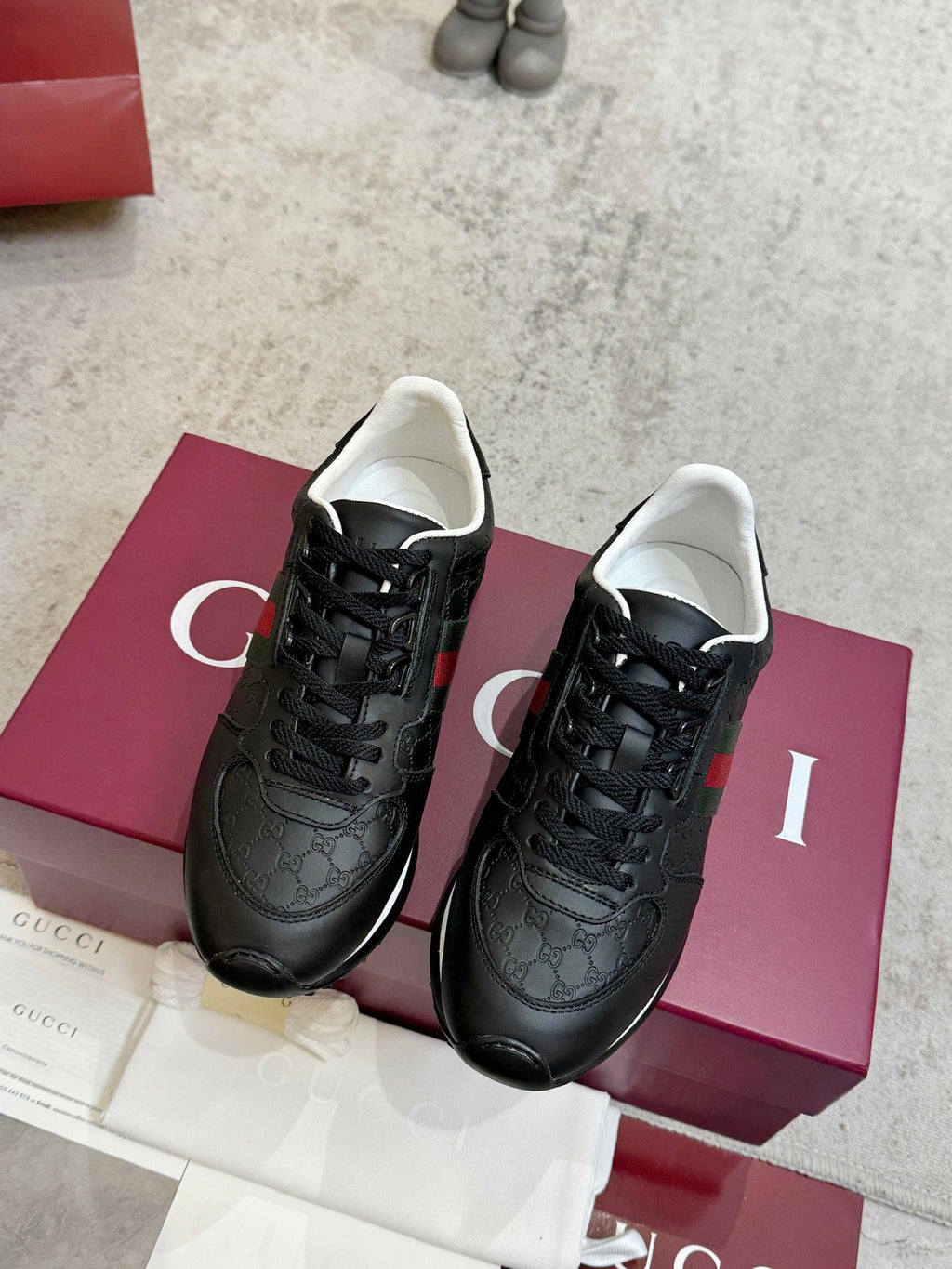 Gucci unisex lace-up sneakers, black with green and red web stripe, low rubber sole