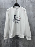 White long-sleeve sweatshirt with Dior logo and text graphic on chest