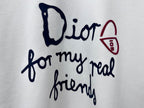 White sweatshirt chest close-up: Dior script and 'for my real friends' graphic