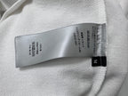 Inside neck care label on white sweatshirt with Dior tag