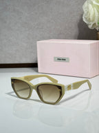 Olive green sunglasses with tinted lenses and pink logo case