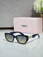 Navy sunglasses with dark lenses and pink logo case
